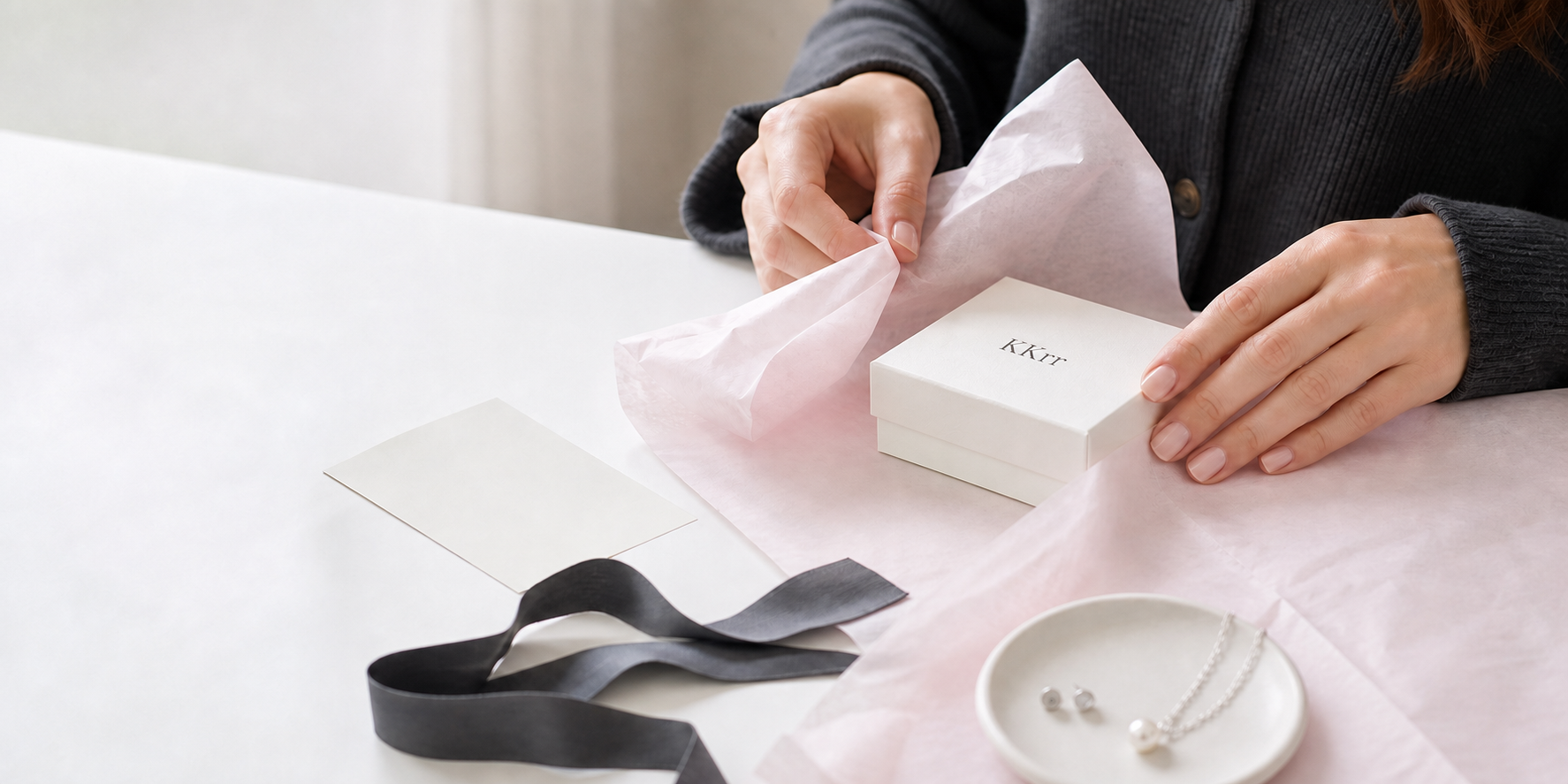 KKrr jewelry gift box being wrapped by hand